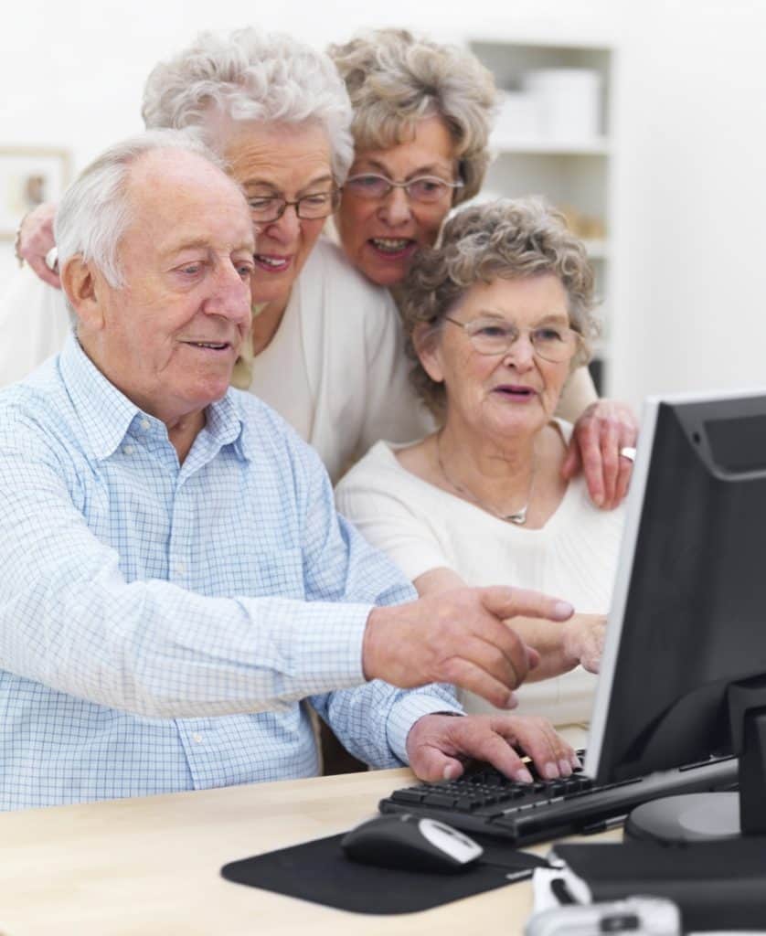 computer-838x1024 Older folks looking at computer